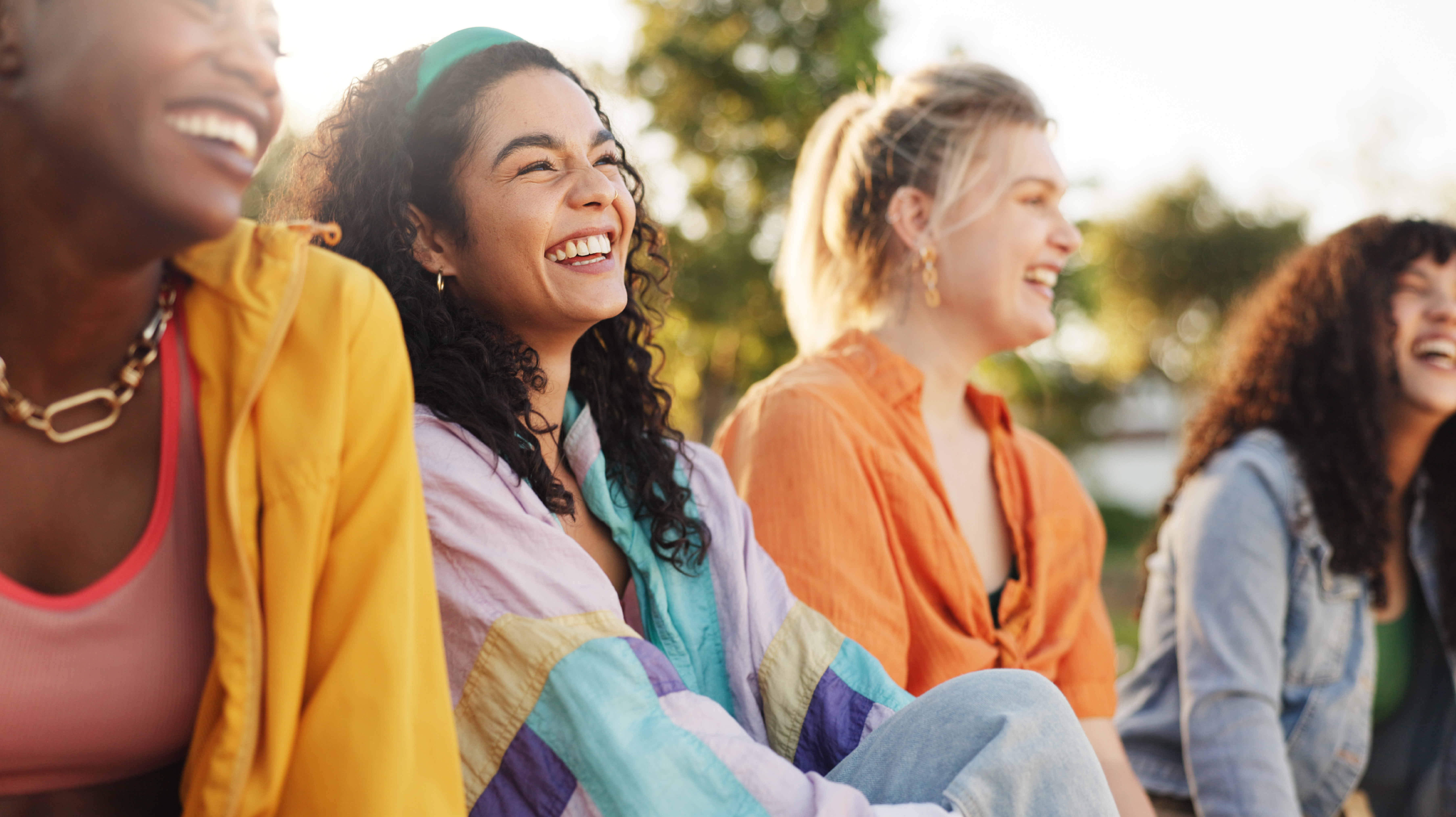 Four women smiling