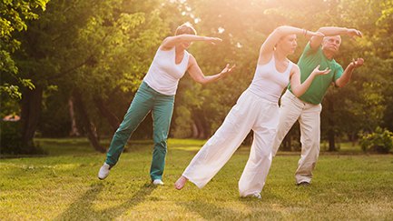 Three people doing Tai Chi