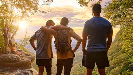 group of people standing on mountain