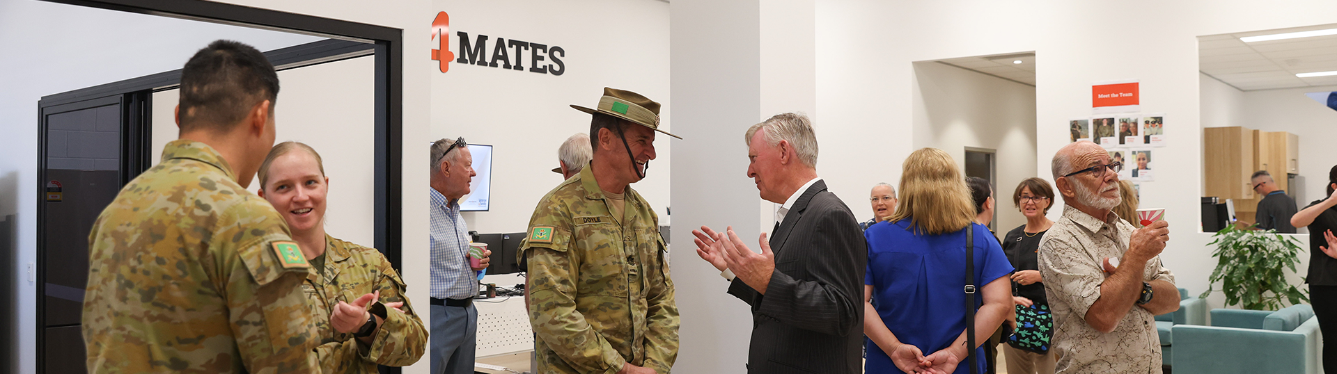 Group attending the official opening of the RSL Queensland Veteran & Family Wellbeing Centre in Brisbane. Some in Defence uniform and others in plain clothes.