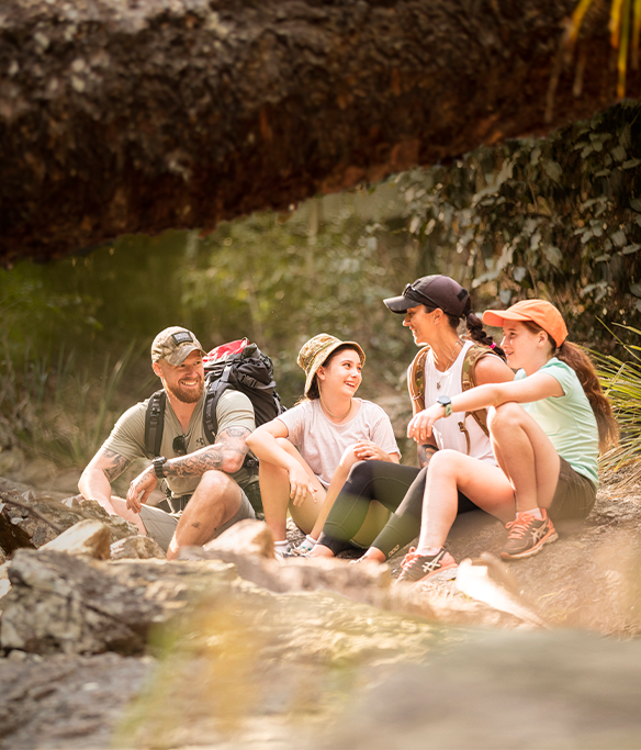 Veteran family of four sitting together outdoors